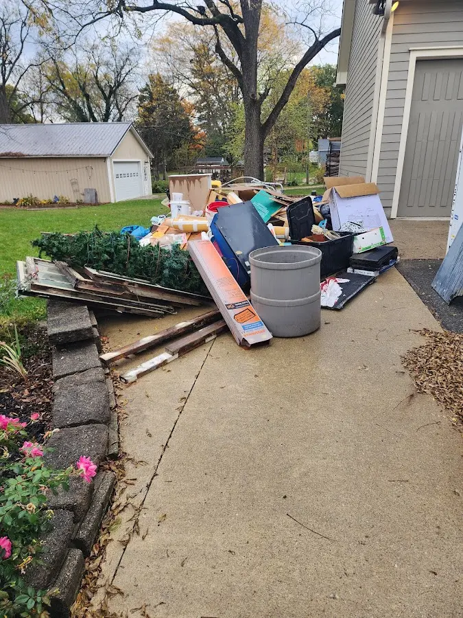 Dumpster being loaded with debris for Residential Dumpster Rental in Brady